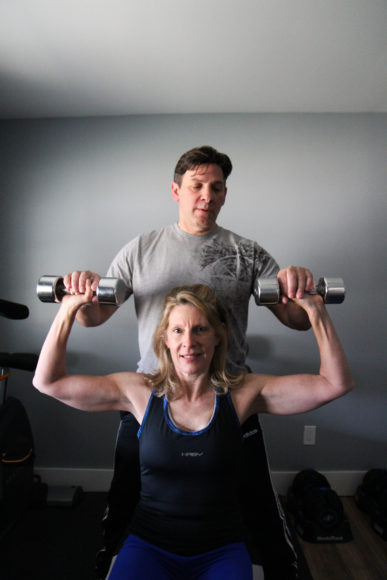 Personal trainer Billy Goda seen here with Dobbs Ferry client Jocelyn Brose believes that his objectivity helps spur his clients: “I’m a fitness professional who’s a friend, not a friend who’s a fitness professional.” Photograph by Alexandra Cali.