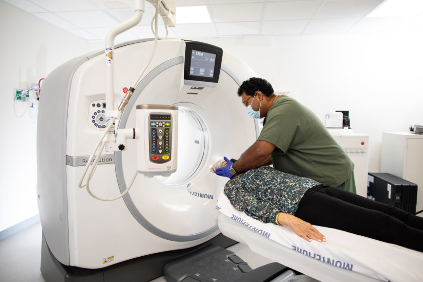 Radiology technician Saji Koshy assists a Montefiore New Rochelle patient who is about to have an MRI.
Photographs courtesy 
Montefiore New Rochelle Hospital.