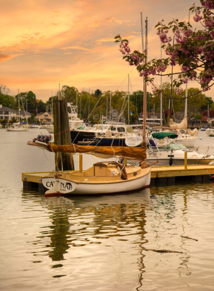 Boats berthed amid the rippling waters and sherbet skies of Mamaroneck Harbor. Photograph by Alexandra Cali.