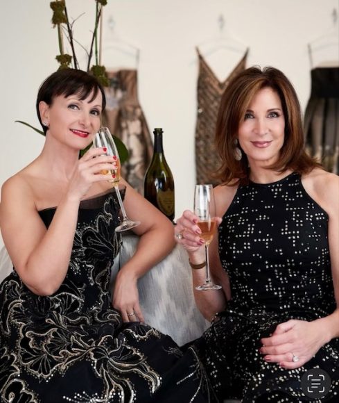 Anastasia Cucinella and Debra O’Shea, co-owners of Mary Jane Denzer in White Plains, toast their store's 40-plus years. Photograph by ChiChi Ubiña.