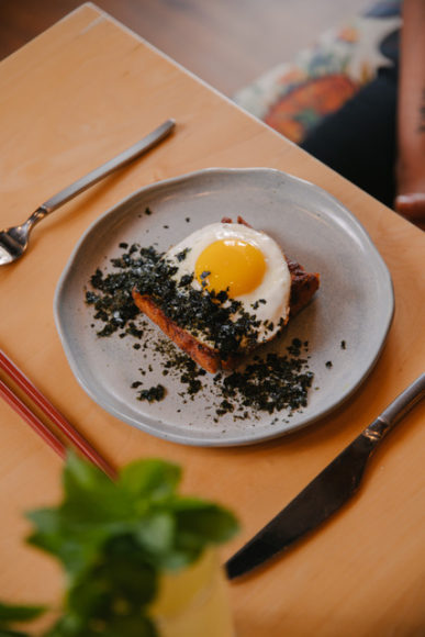 Shrimp Toast on milk bread with a sunny egg and chopped nori.